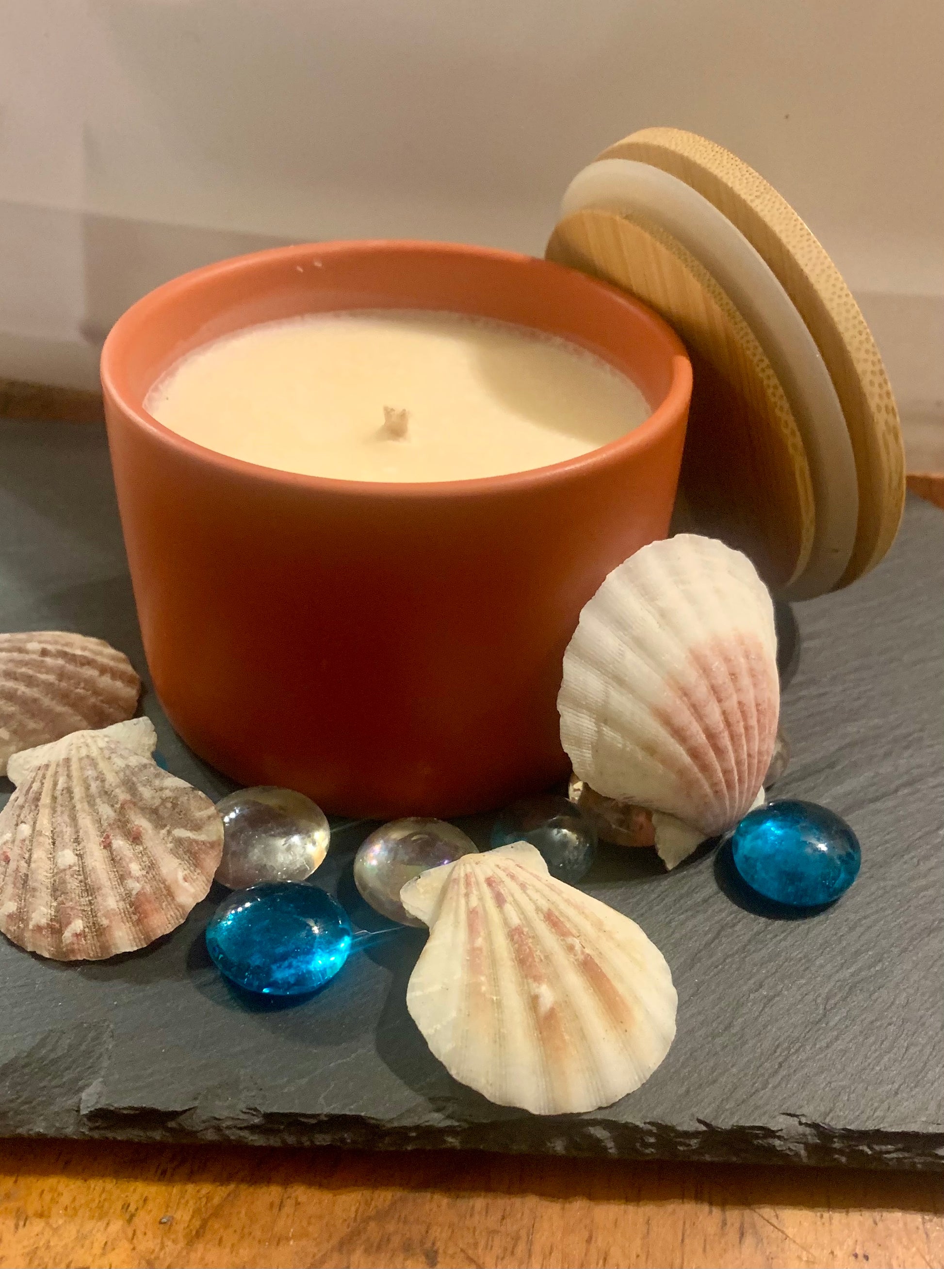 Soy candle scented with Beach linen in a terracotta ceramic container 